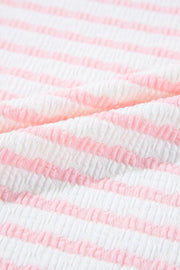 Textured blush pink and white striped loungewear fabric detail
