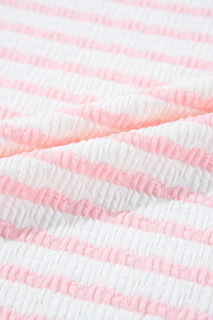 Textured blush pink and white striped loungewear fabric detail
