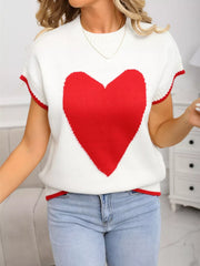 White knit top with large red heart graphic, crew neck, short sleeves, and ribbed red trim.