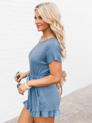 Light blue off-shoulder romper with ruffle hem and drawstring waist.