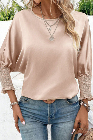 Satin batwing blouse in beige with shirred cuffs and crew neck.