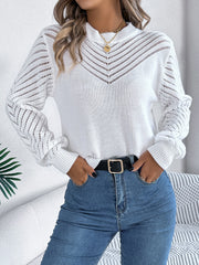 White openwork chevron knit sweater with blouson sleeves and mock neckline.