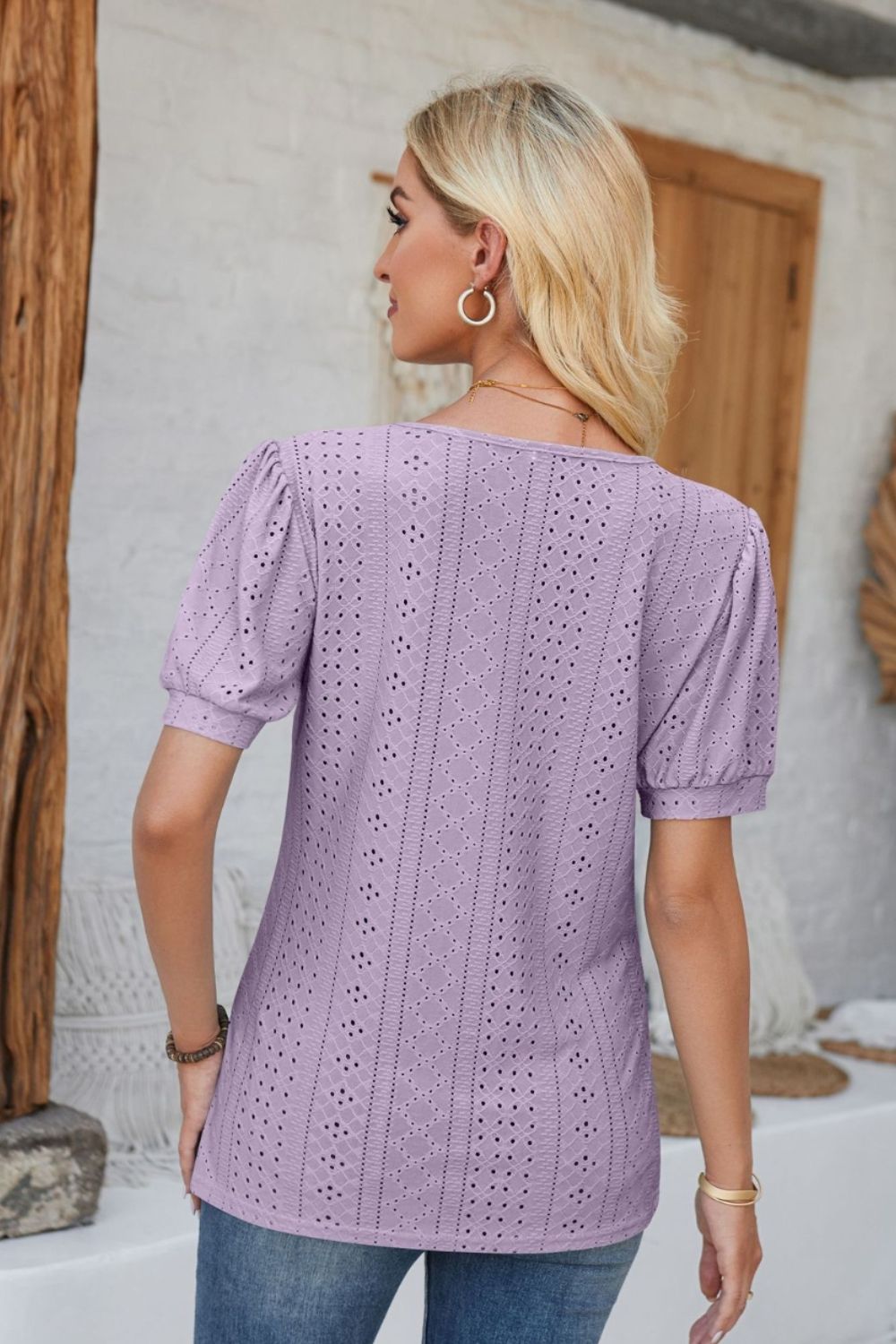 Lavender perforated puff sleeve henley blouse with eyelet detail.