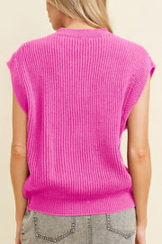 Fuchsia pink ribbed knit vest with a mock neck and sleeveless design.