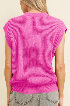 Fuchsia pink ribbed knit vest with a mock neck and sleeveless design.