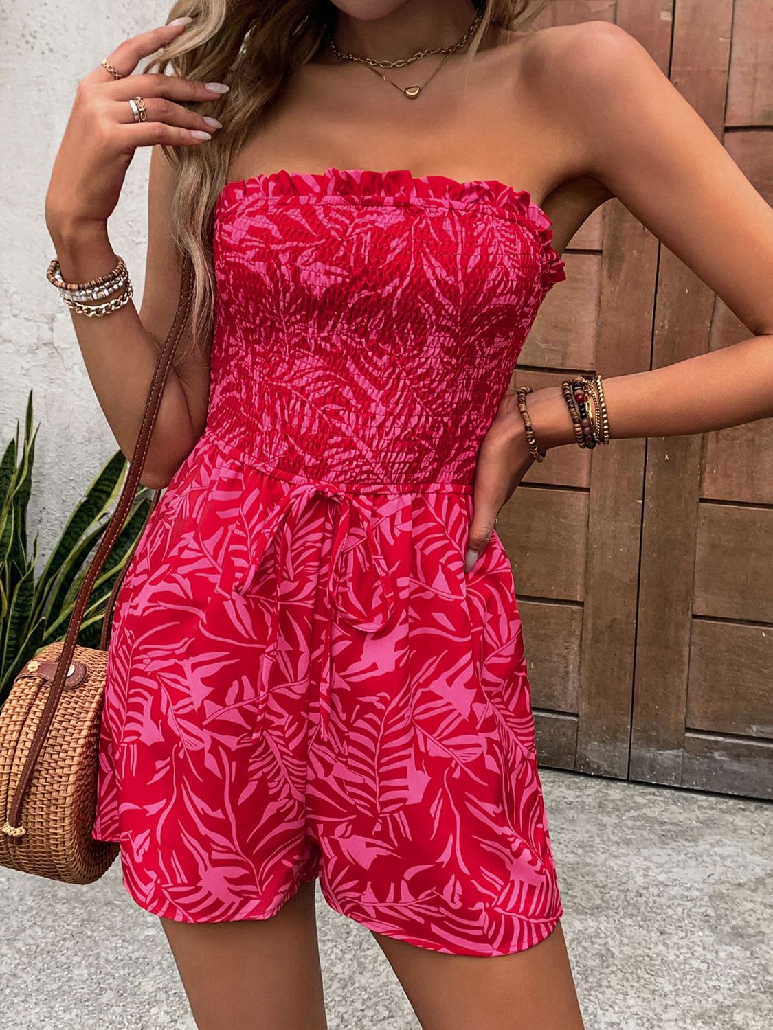 Smocked bandeau romper in strawberry leaf print with tie waist detail