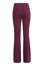 Burgundy flare-leg performance trousers with back pockets.
