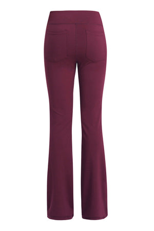 Burgundy flare-leg performance trousers with back pockets.