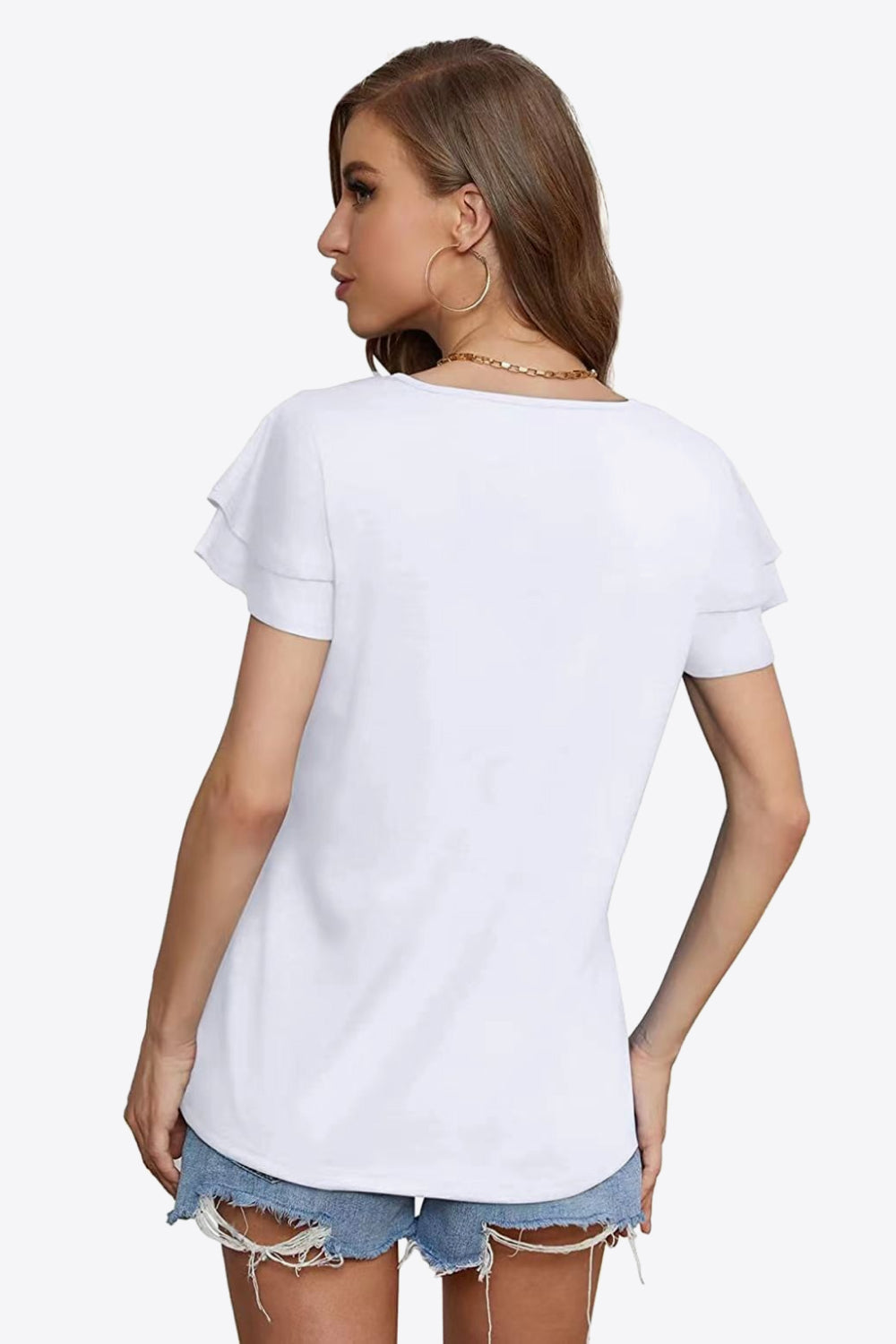 White tiered sleeve blouse with a keyhole neckline detail.