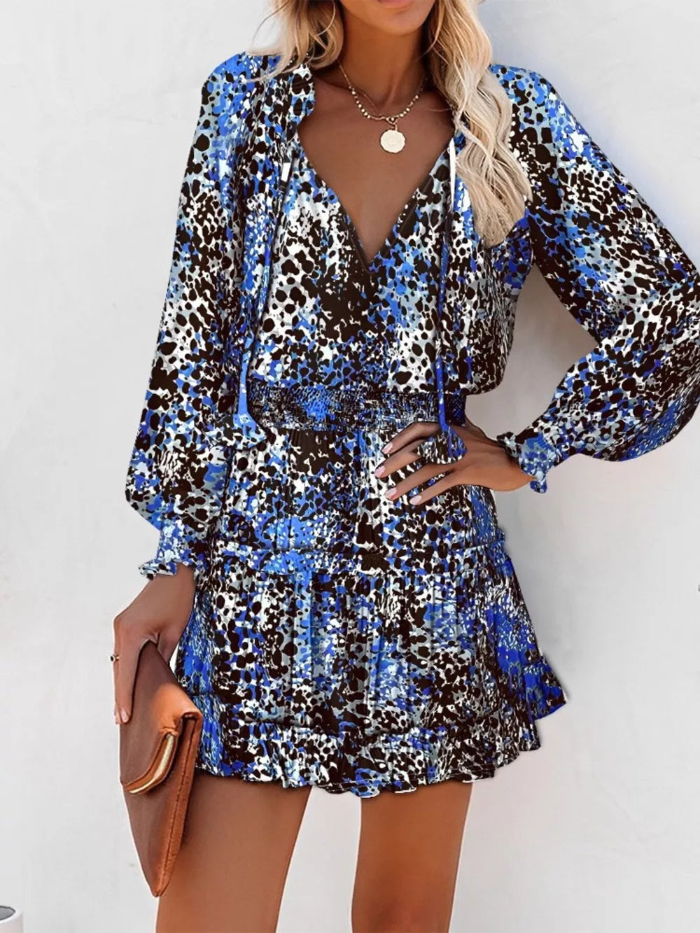 Blue leopard print tiered mini dress with ruffles and tie neck