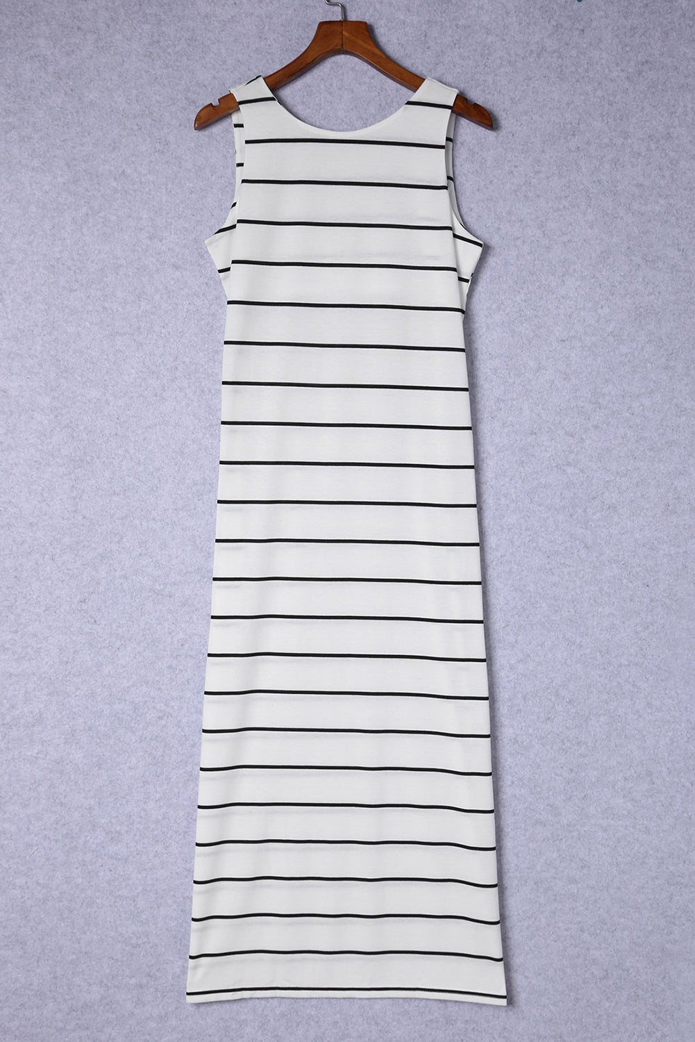 White and black striped maxi dress with a round neck and sleeveless cut.
