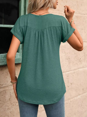 Relaxed sage Henley T-shirt with button detail and cuffed short sleeves, shown from the back.