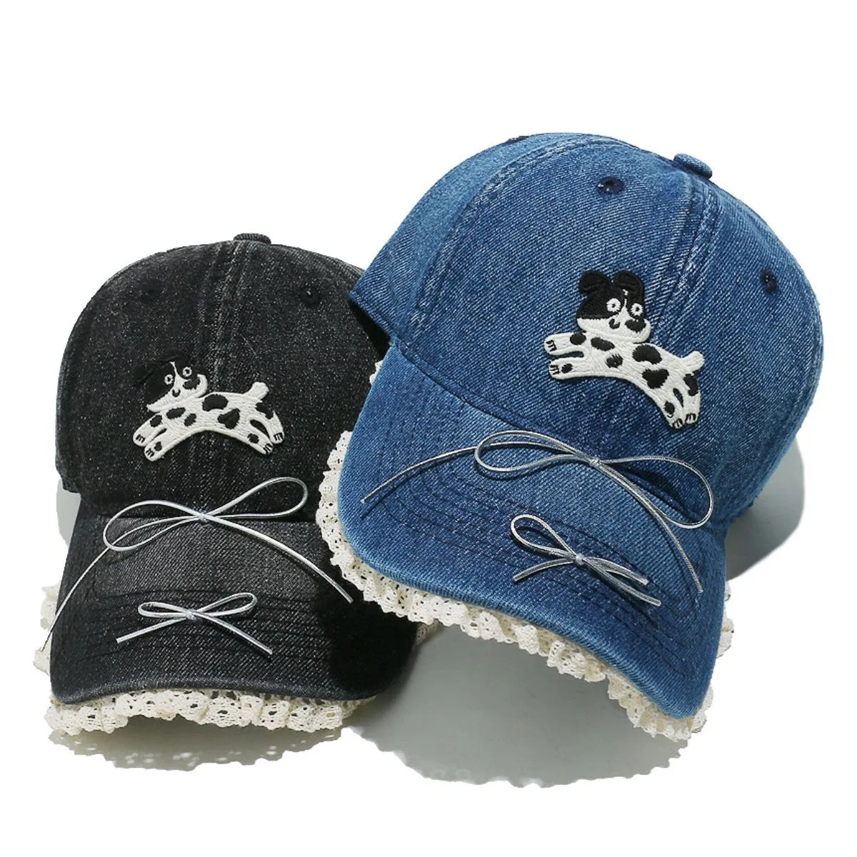 Denim baseball cap with puppy appliqué, lace trim, and bow details.