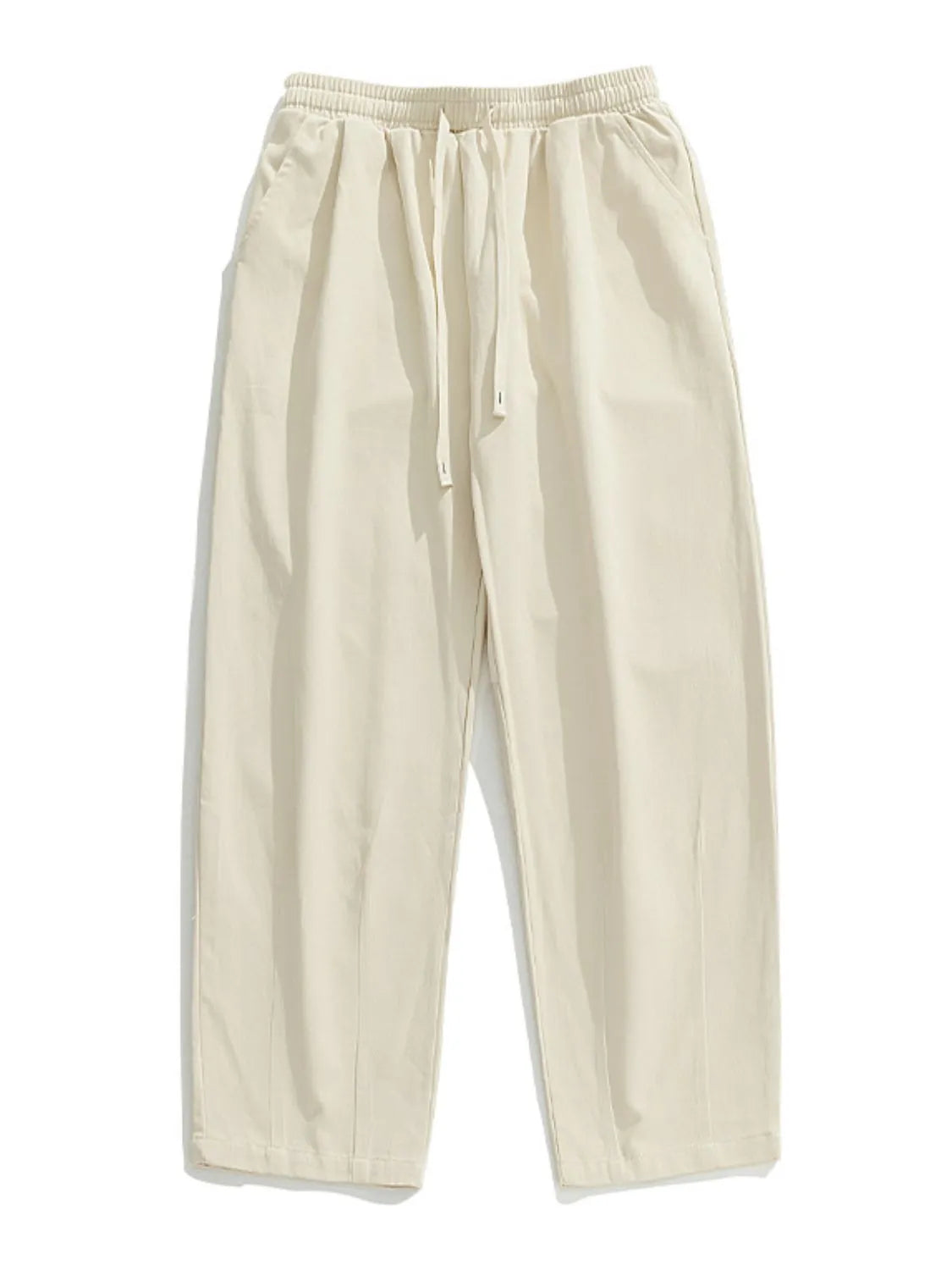 Ivory wide-leg pleated drawstring trousers with a relaxed fit and side pockets.