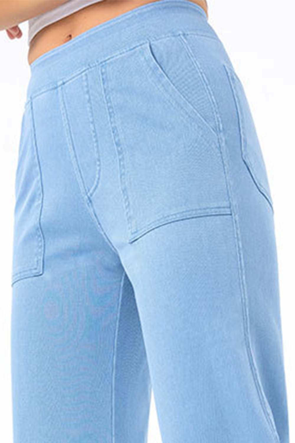 Light wash denim jeans with utility pockets and straight leg cut.