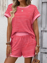 Relaxed striped loungewear set in strawberry pink with cuffed sleeves and elastic waist shorts.