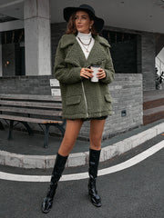 Green teddy moto jacket with asymmetrical zip and collared neckline.