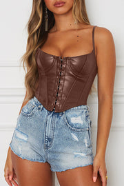 Dark brown faux leather corset cami top with hook-and-eye front closure and spaghetti straps.
