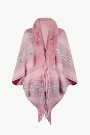 Textured knit cape in dusty pink with faux fur collar and fringe detail