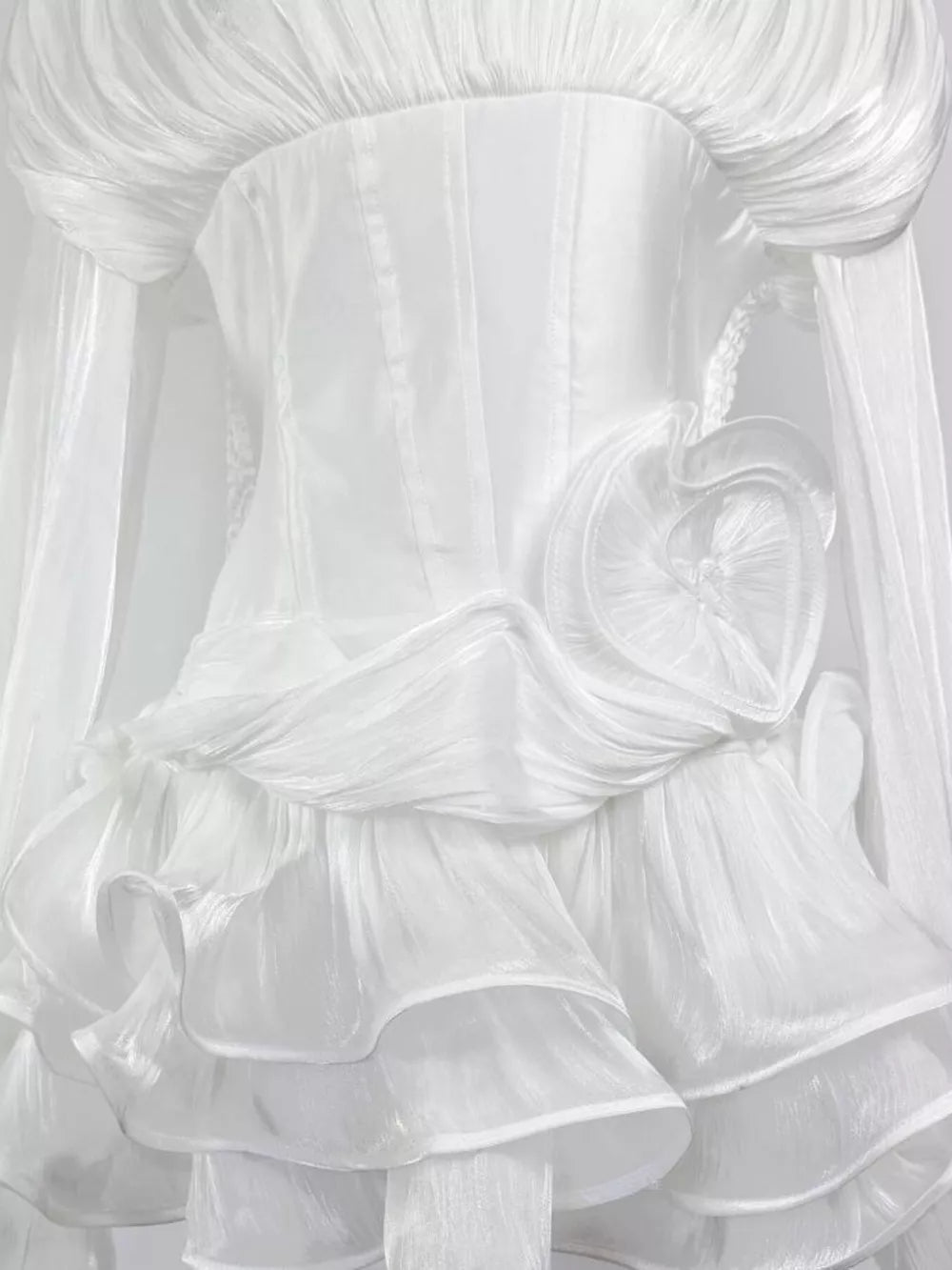 White ruffled mini dress with corset waist and heart detail