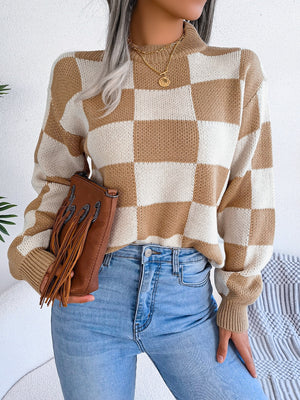 Checkerboard knit mock neck pullover in camel and white acrylic with ribbed cuffs and hem.