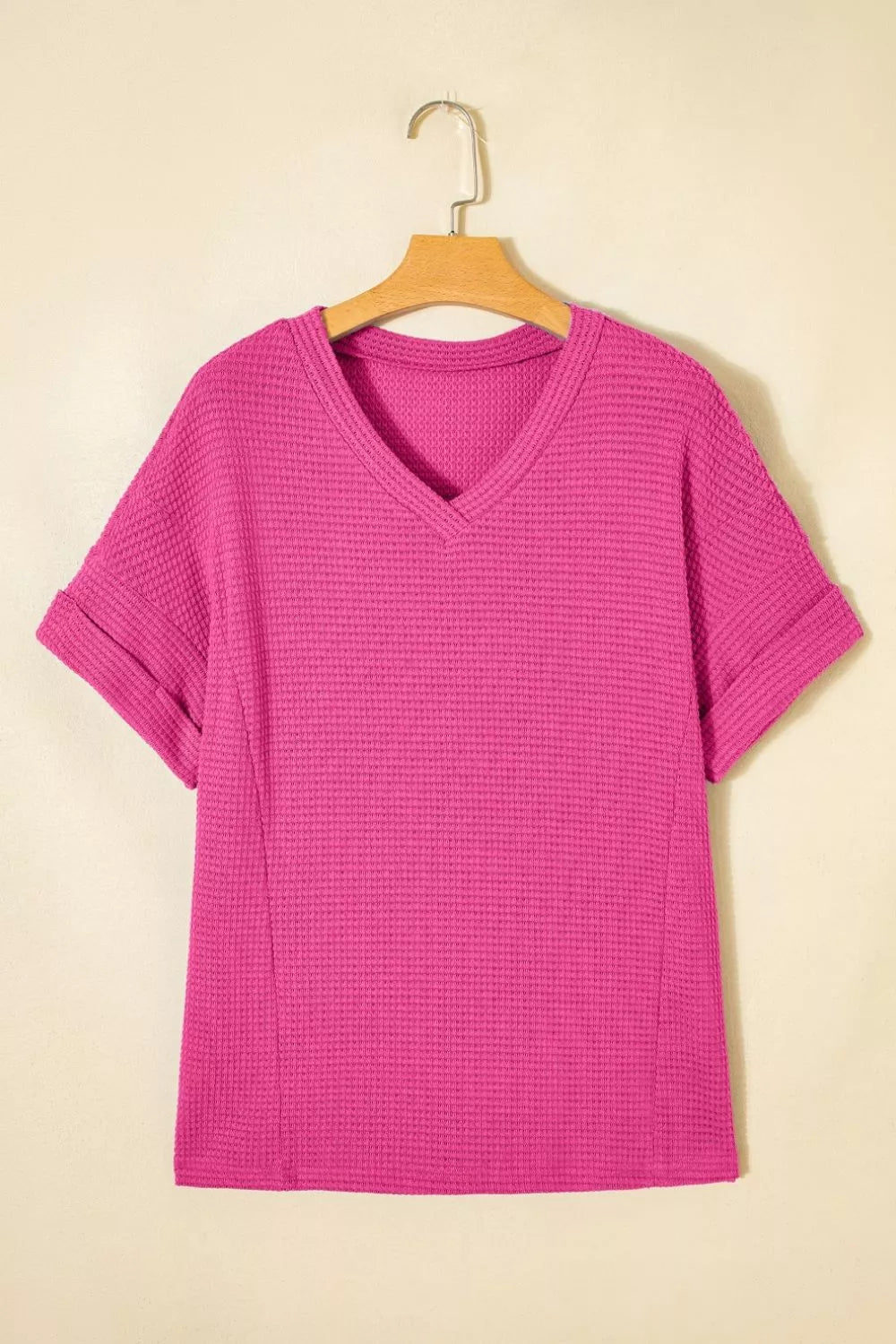 Hot Pink waffle knit V-neck t-shirt with cuffed short sleeves.