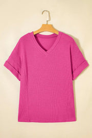 Hot Pink waffle knit V-neck t-shirt with cuffed short sleeves.