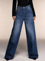Cutout high-waisted wide-leg jeans in blue denim with button closure and pockets.