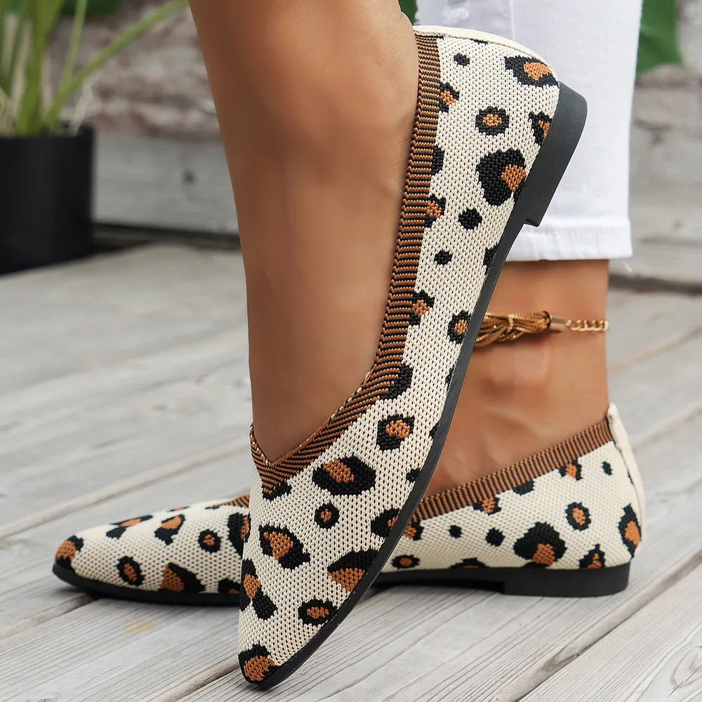 Geometric knit pointed ballet flats in leopard print with a brown trim.