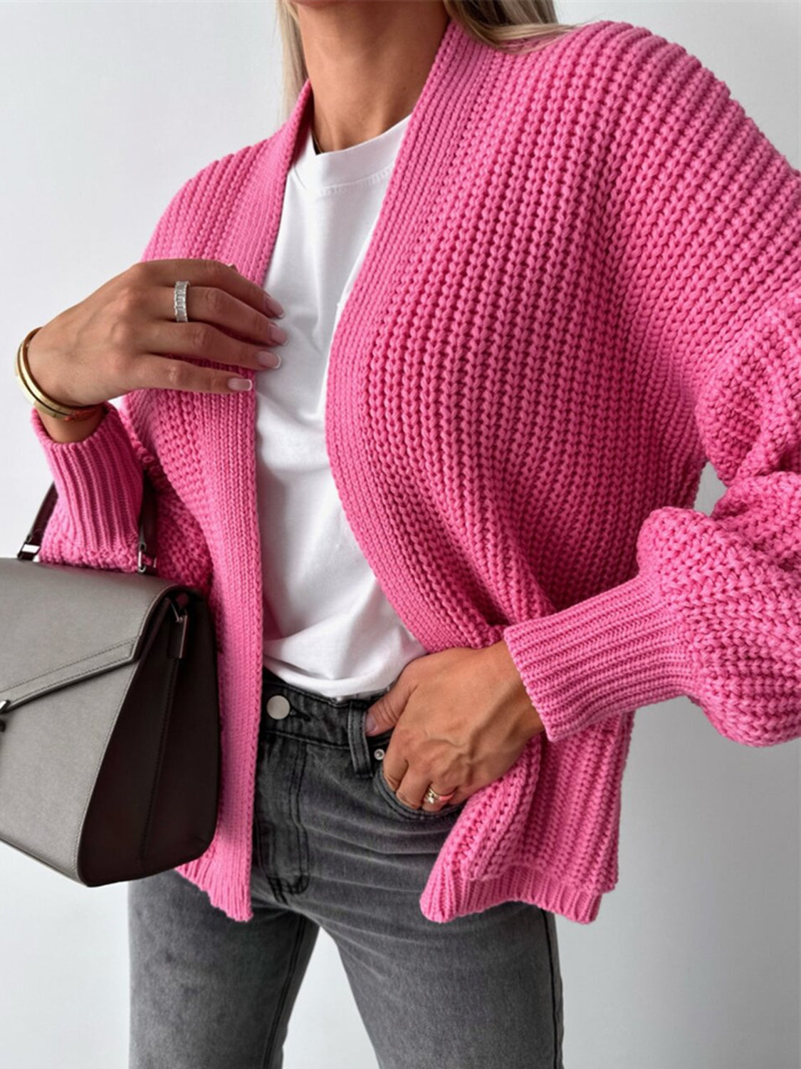Hot Pink textured puff sleeve cardigan with ribbed cuffs and open front.