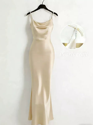 Apricot cowl neck maxi dress with pearl strap detail.