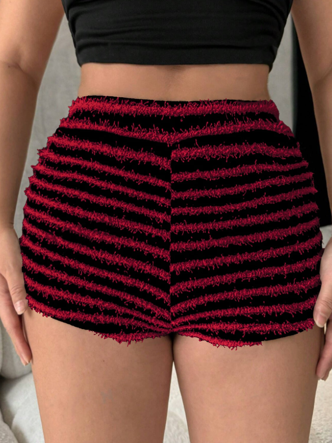 Textured stripe bouclé shorts in black and burgundy with frayed hem.