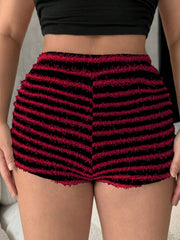 Textured stripe bouclé shorts in black and burgundy with frayed hem.