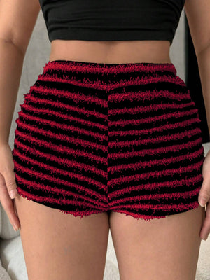 Textured stripe bouclé shorts in black and burgundy with frayed hem.