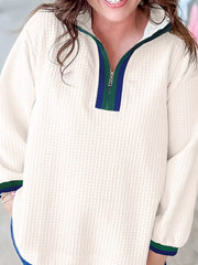 Textured white half-zip sweatshirt with blue and green stripe collar detail.