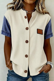 Ribbed knit shirt with denim sleeves, button front, and patch detail.