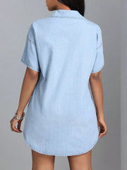 Light blue denim shirt dress with short sleeves and collared neckline.