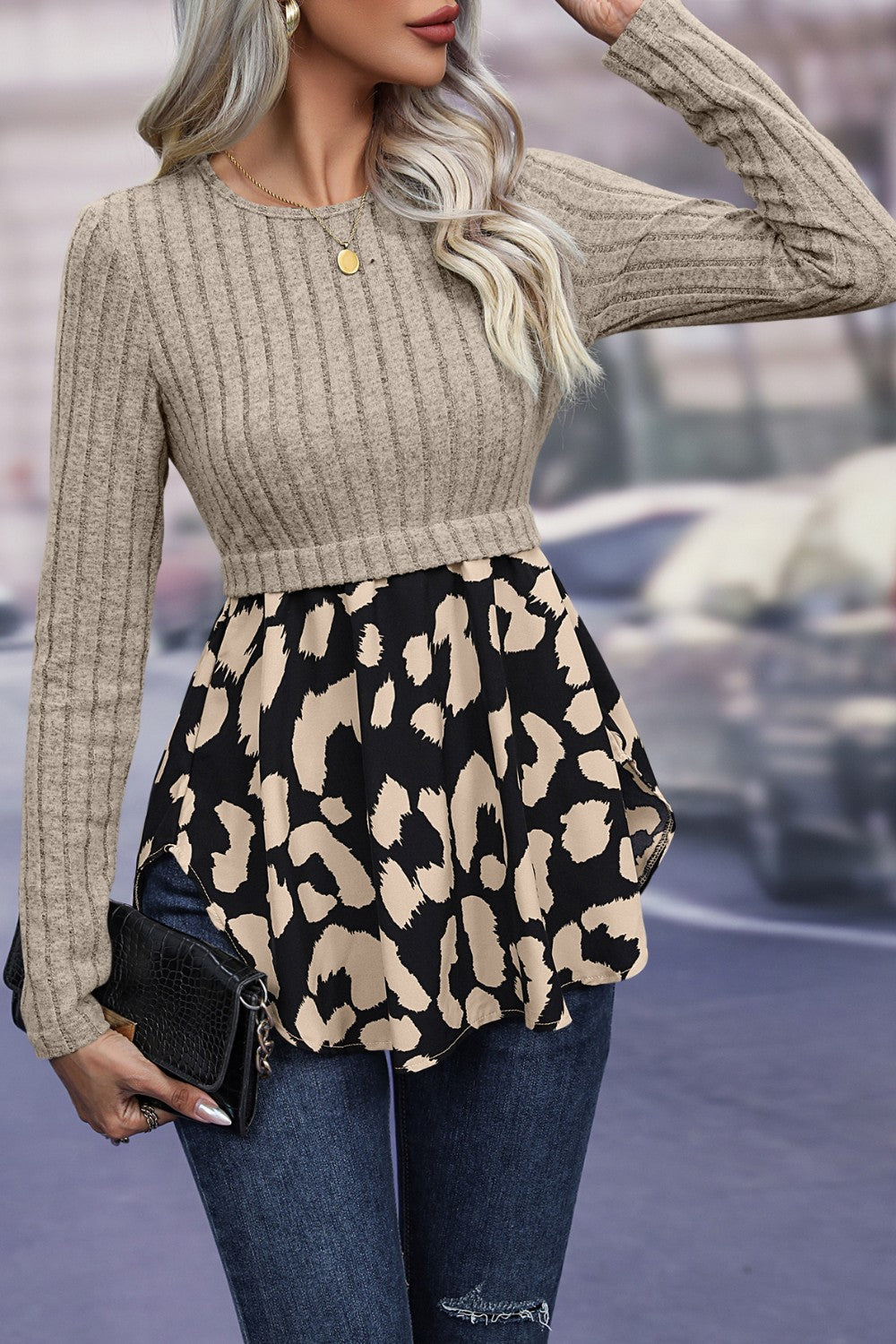 Beige ribbed knit peplum blouse with leopard print skirt and long sleeves.