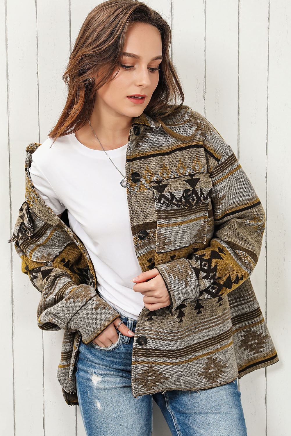 GeoChic collar jacket in camel with tribal pattern and chest pockets.