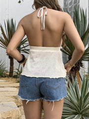 Iridescent shell-embellished halter cami with tie back, cropped knit style.