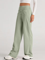 Button-front palazzo trousers in Gum Leaf green with wide legs and pocket details.