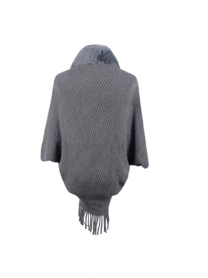 Charcoal knit poncho with faux fur collar and fringe detail