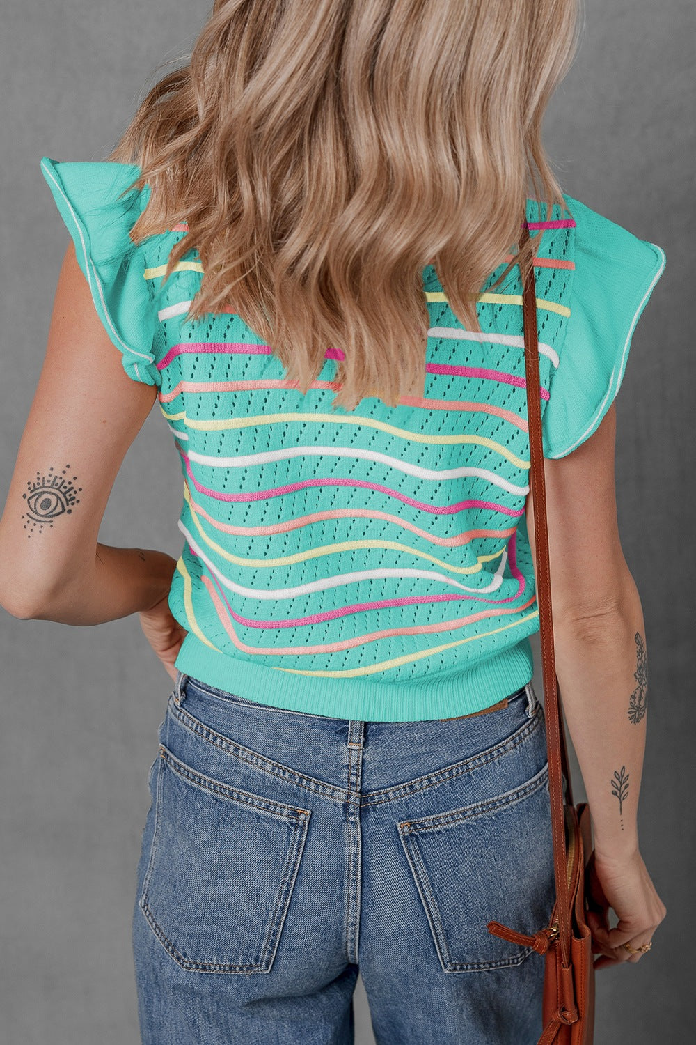 Turquoise striped knit tunic top with ruffled sleeves and a textured pattern.