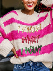 Bold sequin graphic colorblock knit sweater with crew neck and striped pattern.