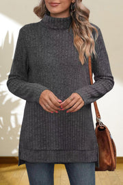 Charcoal ribbed knit turtleneck tunic top with long sleeves and side slits.