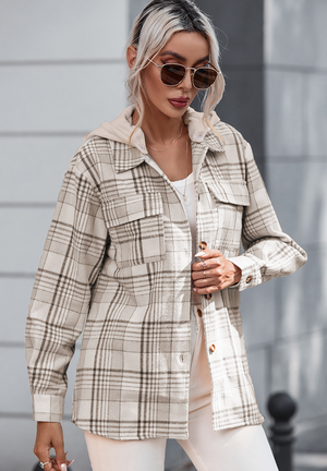 Oversized plaid shacket with attached hoodie and chest pockets.