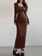 Brown ruched long-sleeve bodycon maxi dress with scoop neck.
