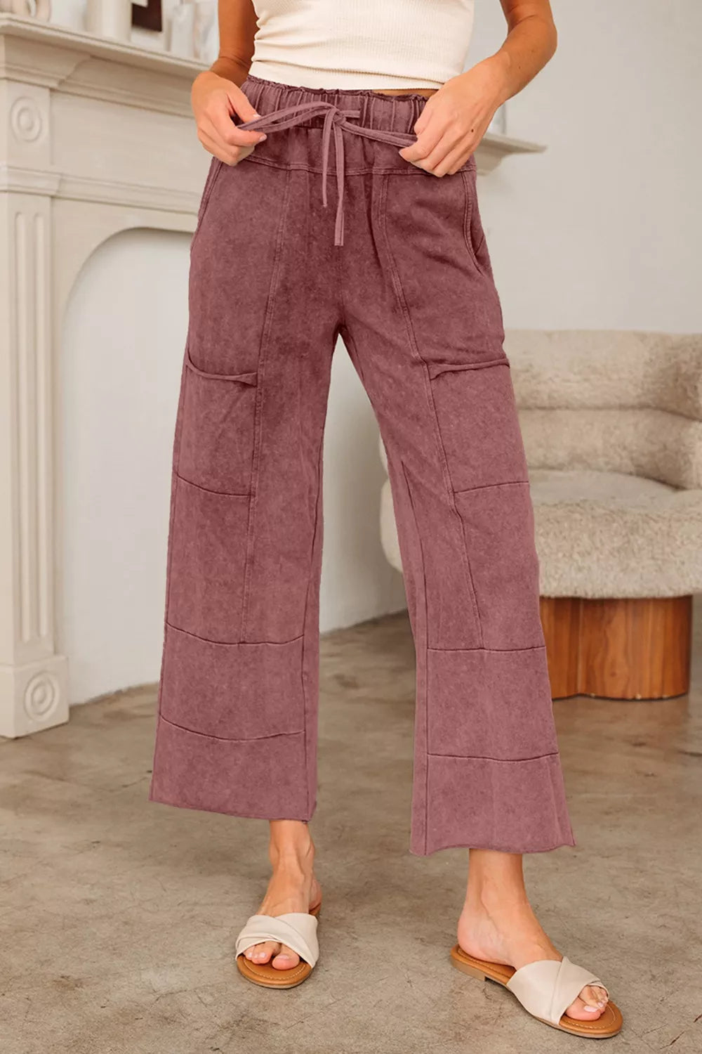 Relaxed wide-leg cotton maternity pants in dusty rose with drawstring waist and patch pockets.