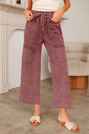 Relaxed wide-leg cotton maternity pants in dusty rose with drawstring waist and patch pockets.