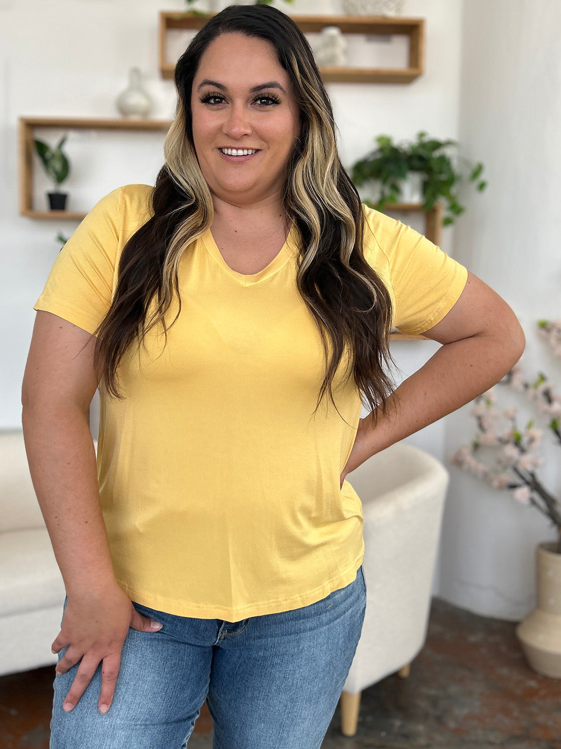 Yellow bamboo v-neck t-shirt with short sleeves and asymmetric hemline